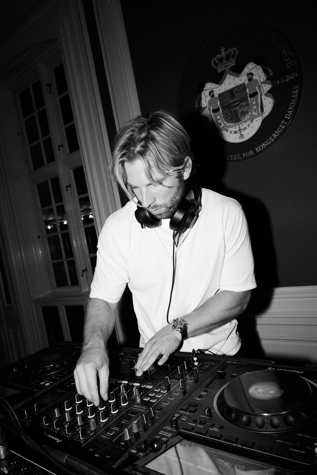 DJ Vejlgaard mixing at the decks