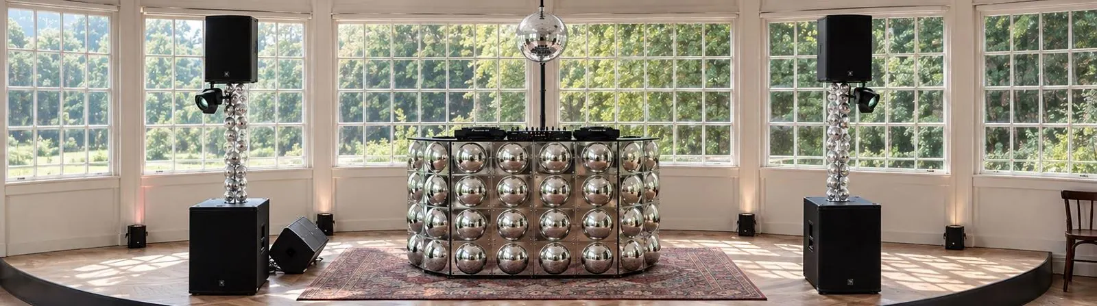 DJ booth with mirror elements by day
