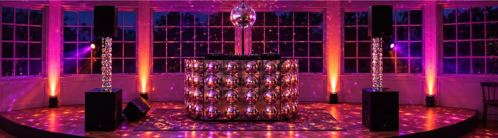 DJ booth with disco ball at night